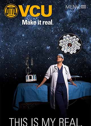 Brent Monseur posing in front of a night sky backdrop and a hospital bed